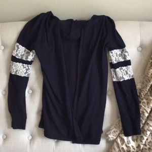 Navy blue hooded cardigan with lace stripes.